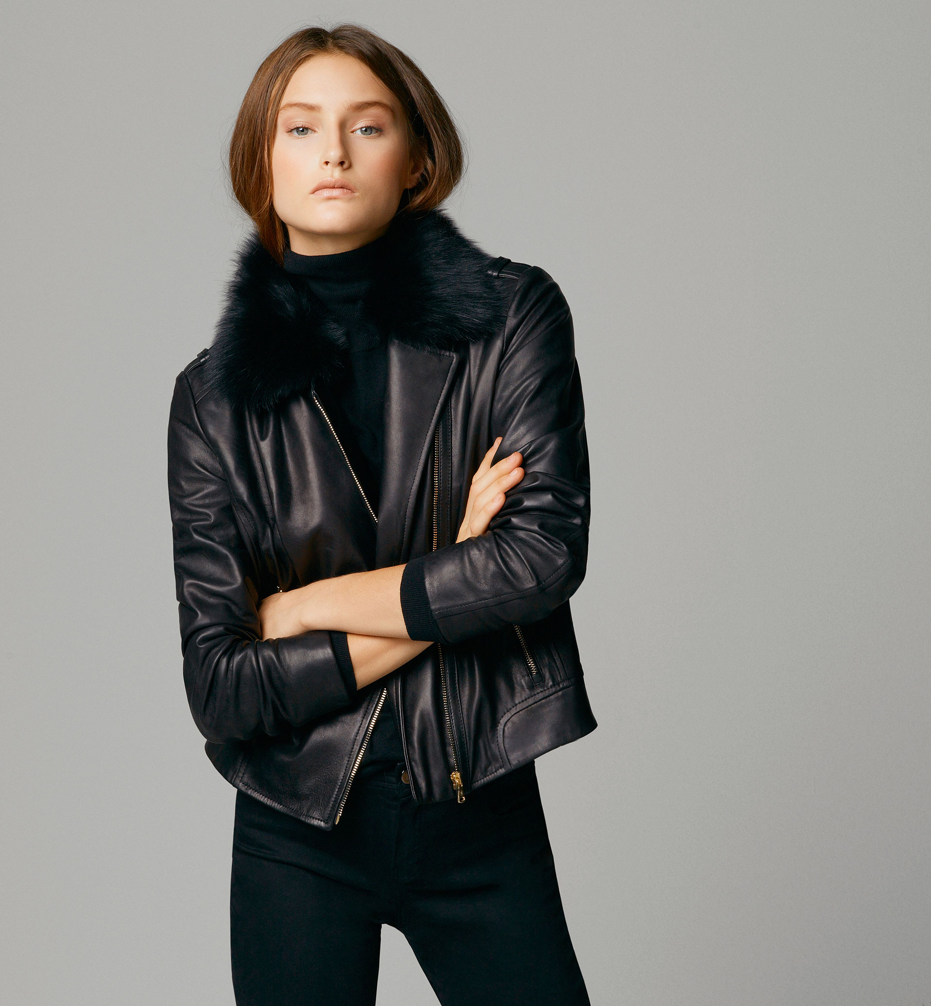 BLACK LEATHER JACKET WITH FUR-LINED COLLAR