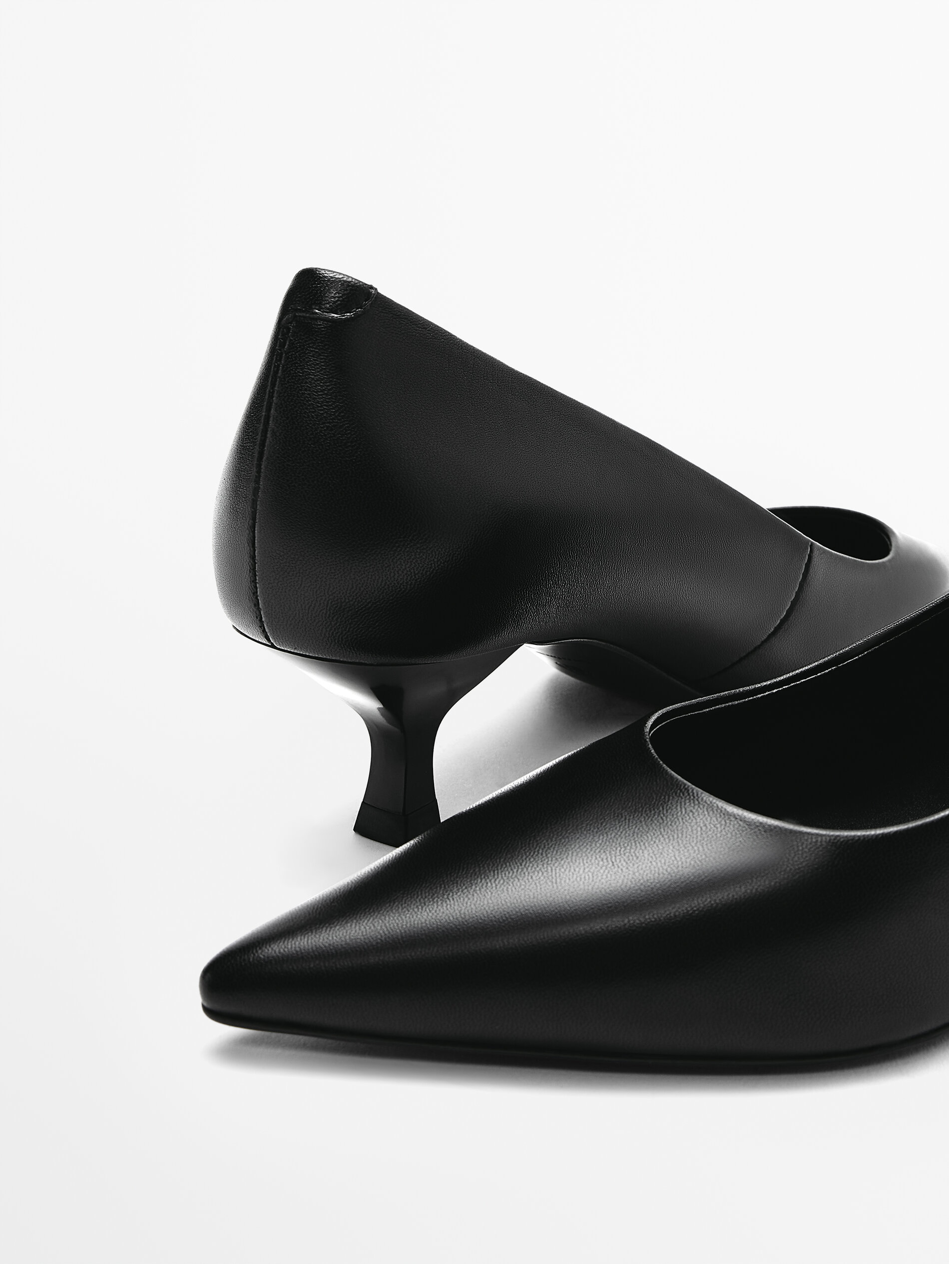 black pointed mid heels