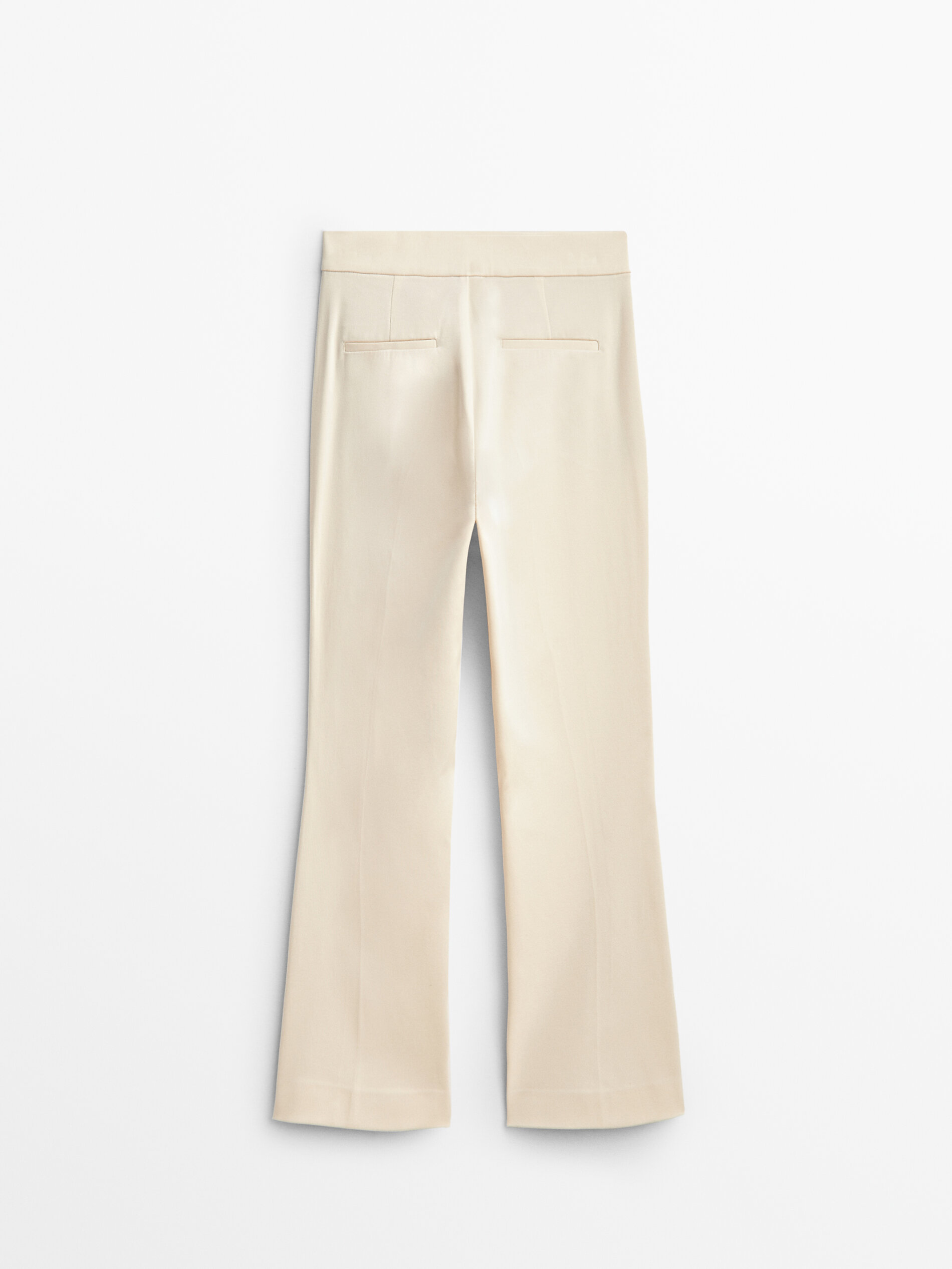 Flared trousers with central seam 