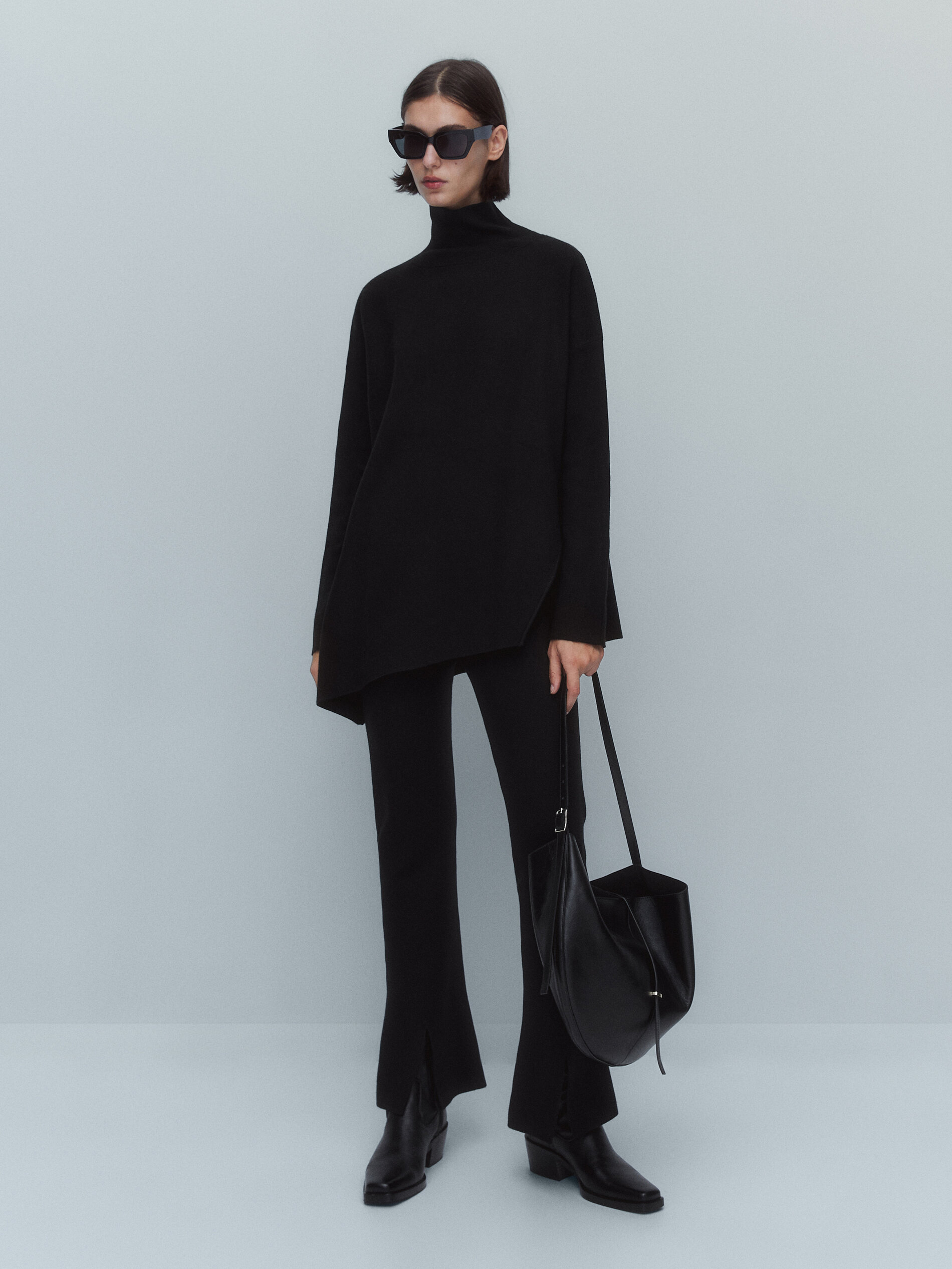 Cape sweater with asymmetric hem 