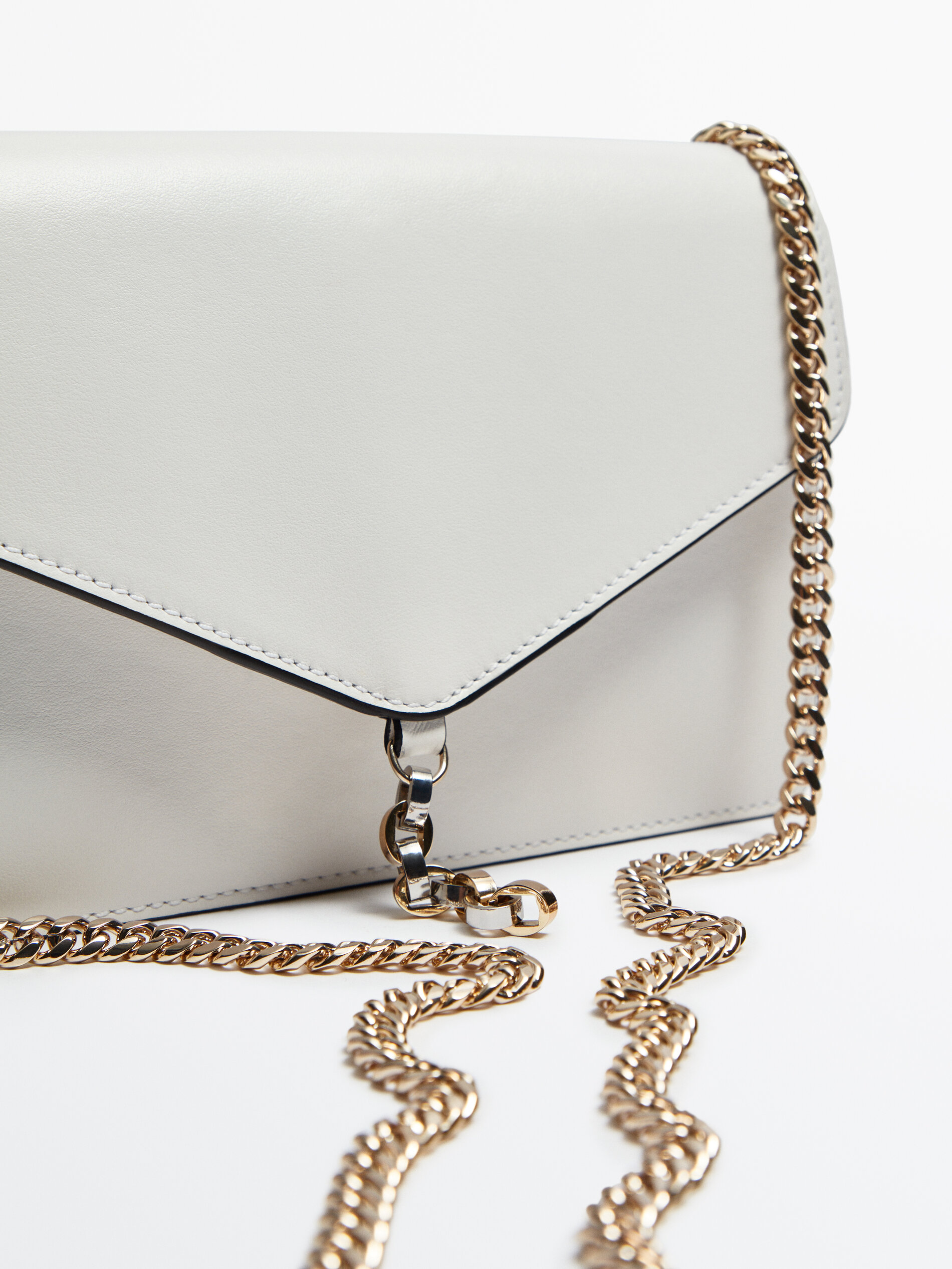 Leather bag with front flap and chain