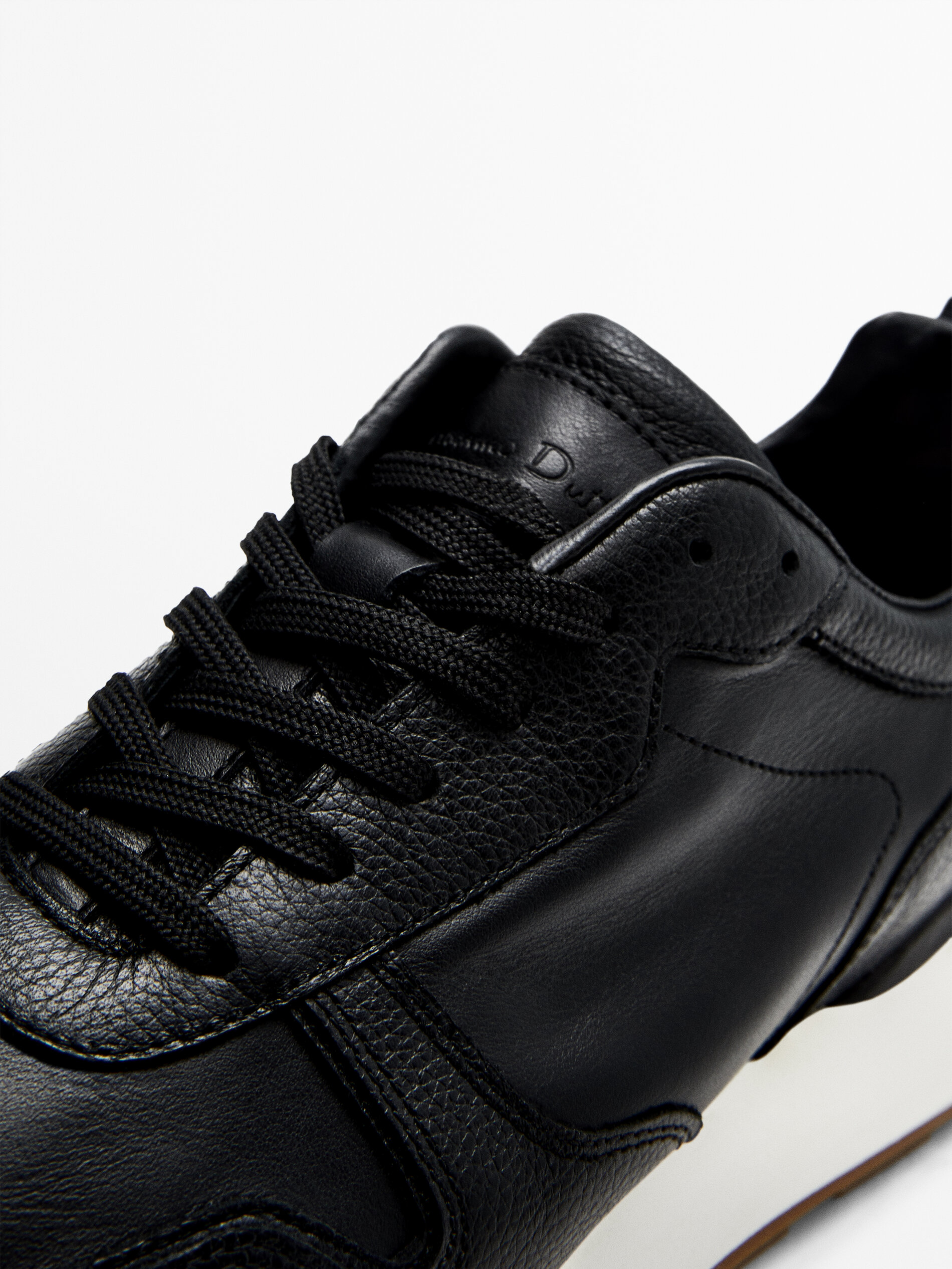 black soft trainers