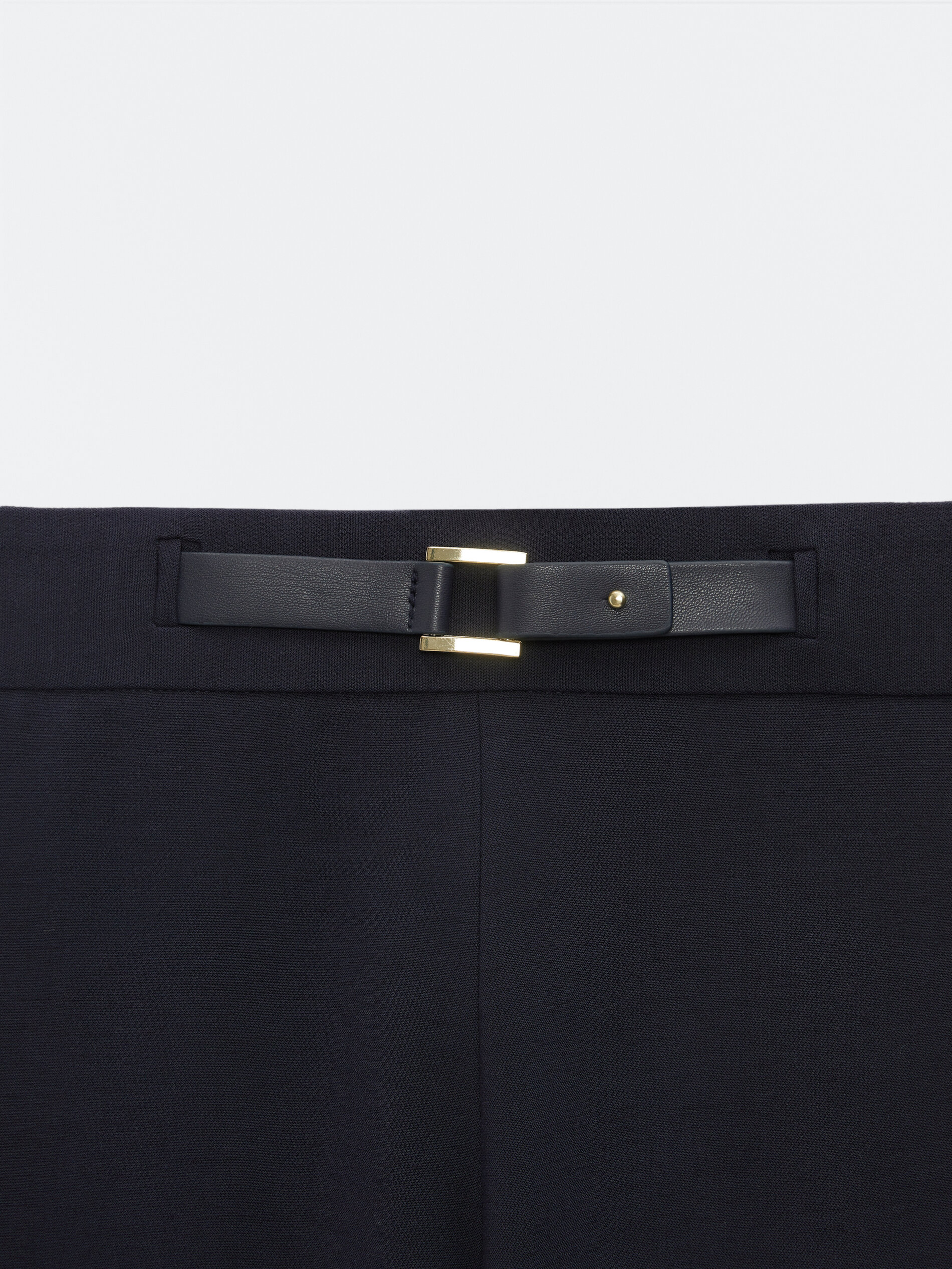 Trousers with front buckle