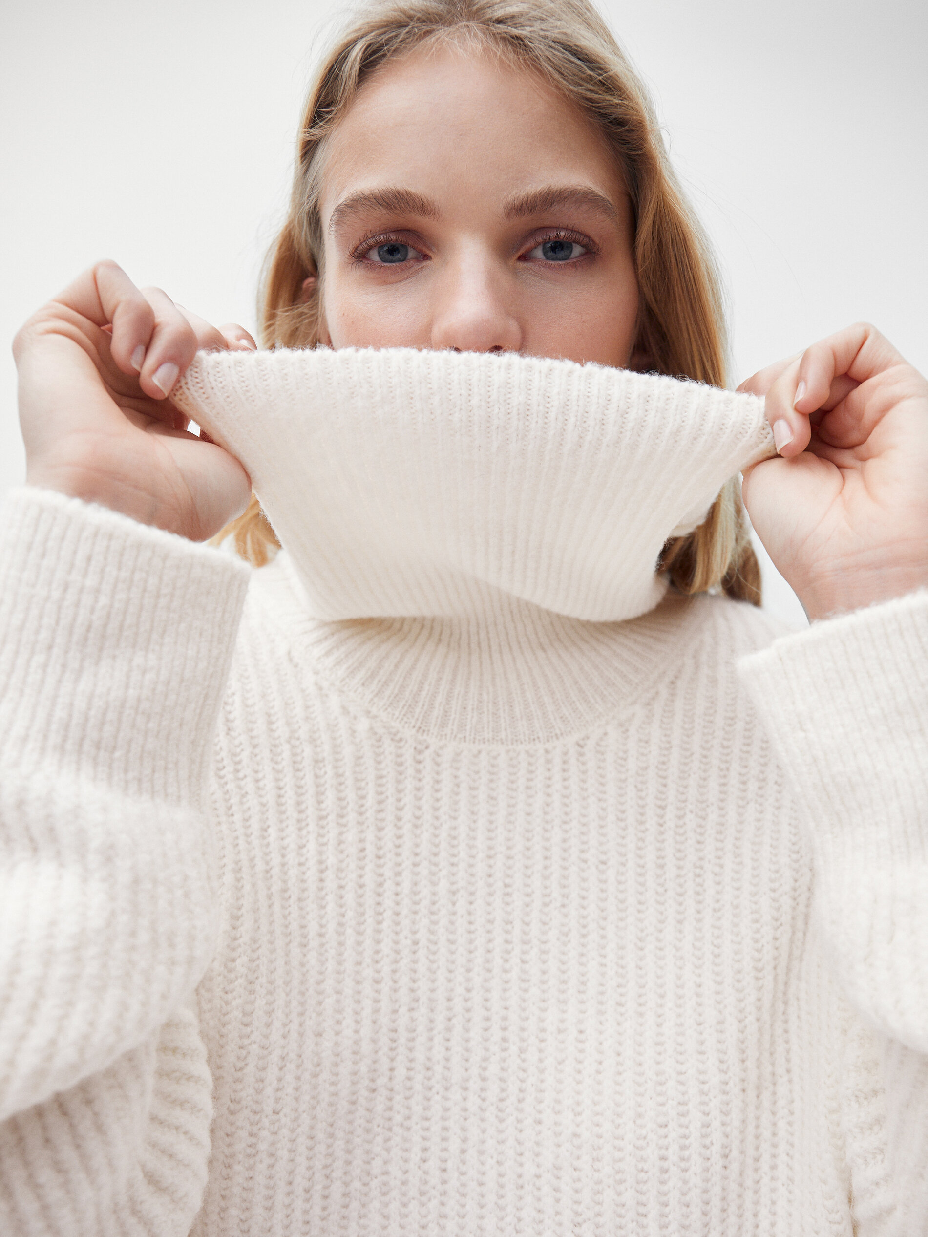 hoe heet een trui met een hoge kraag