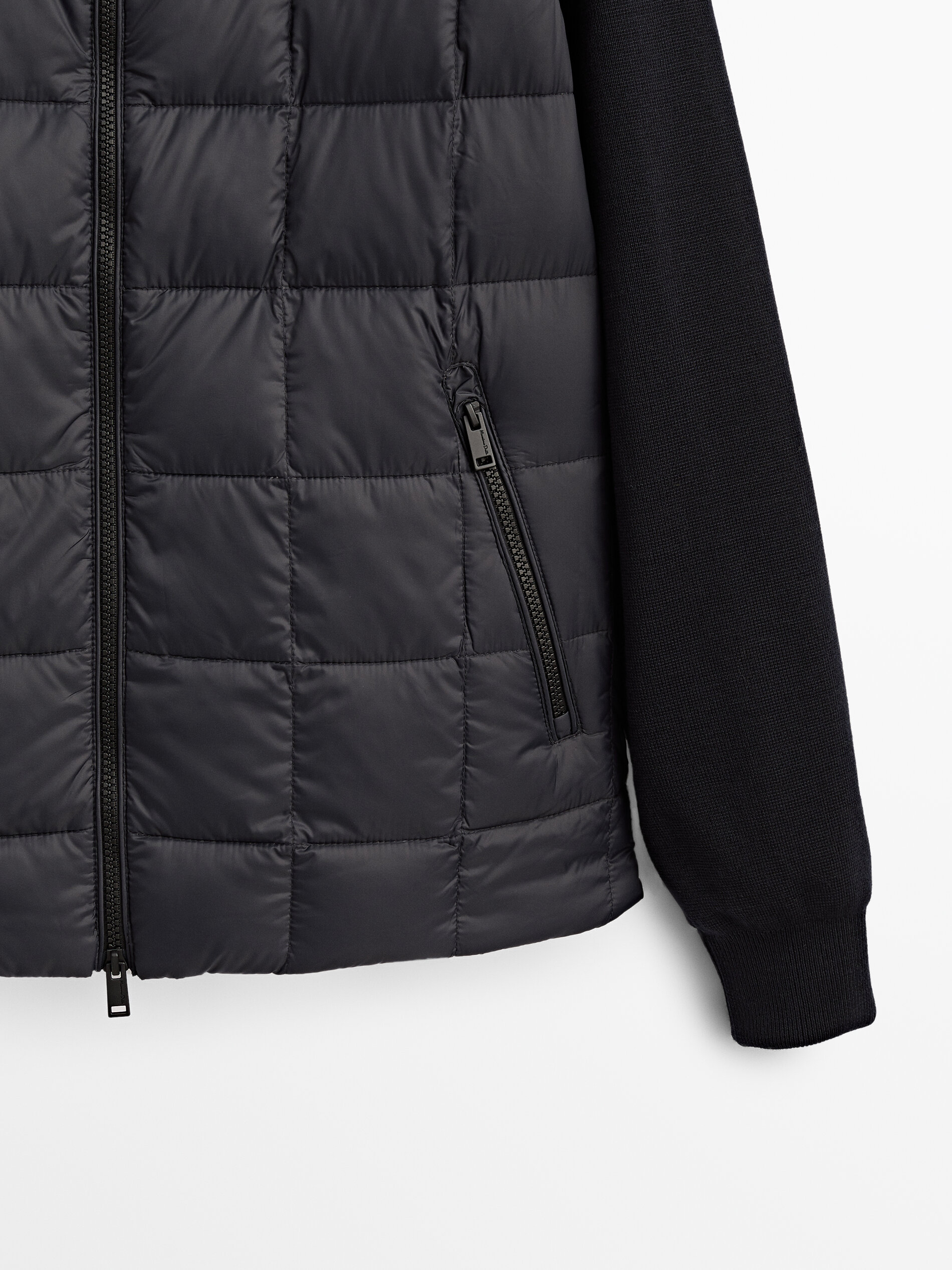 Puffer jacket with contrast knit sleeves