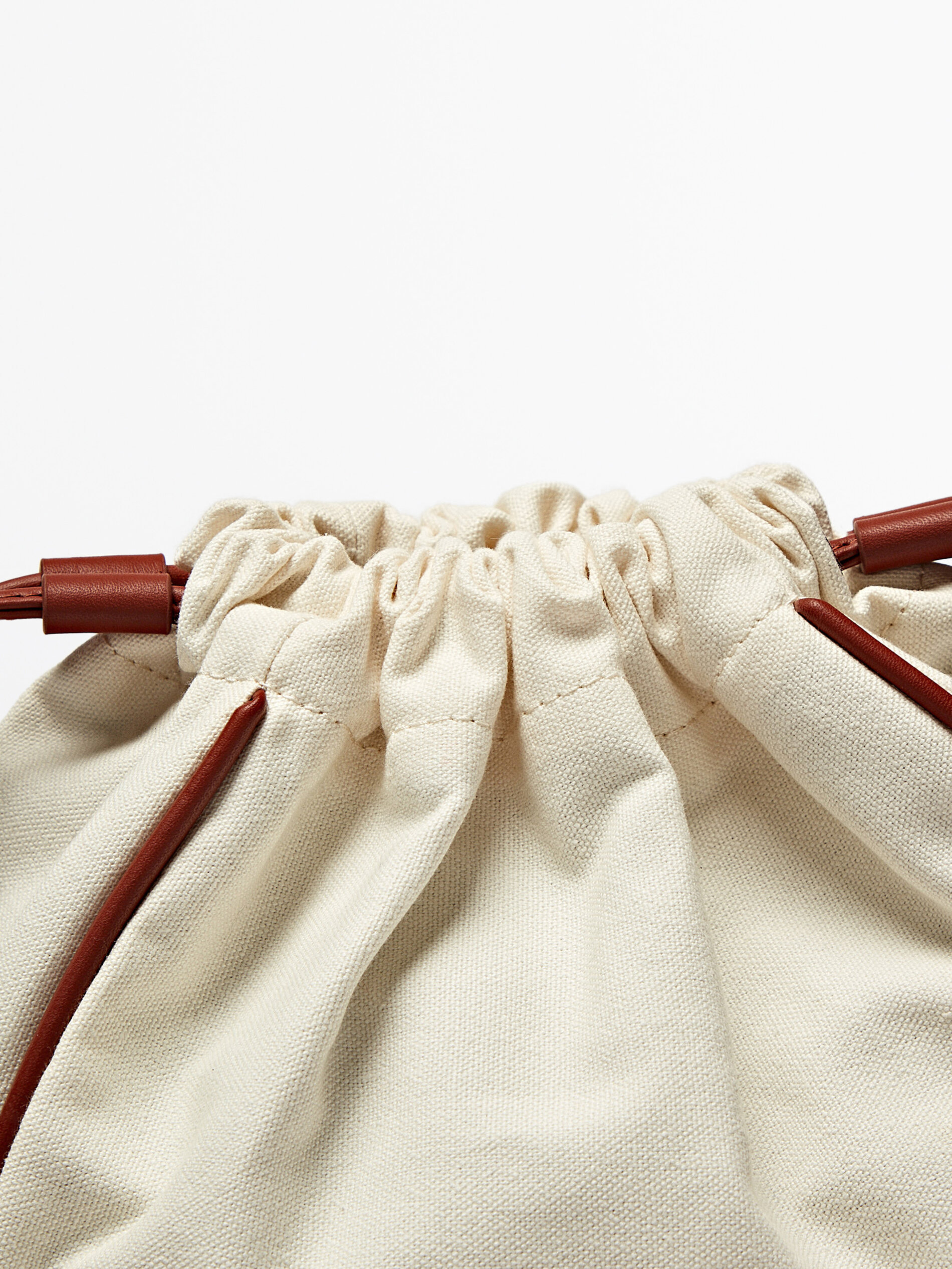 Pouch bag with leather details