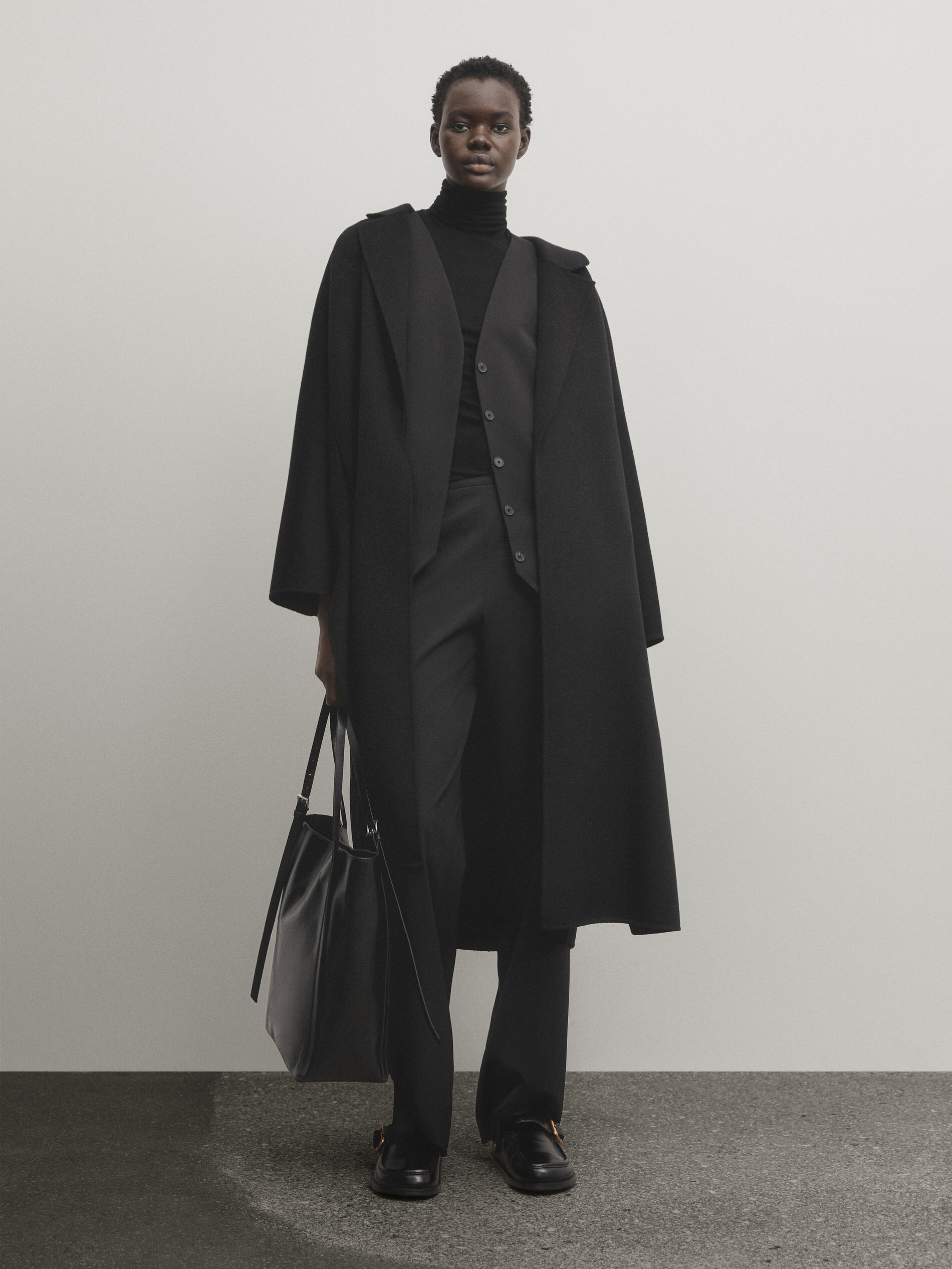 Long black suit waistcoat with hidden button