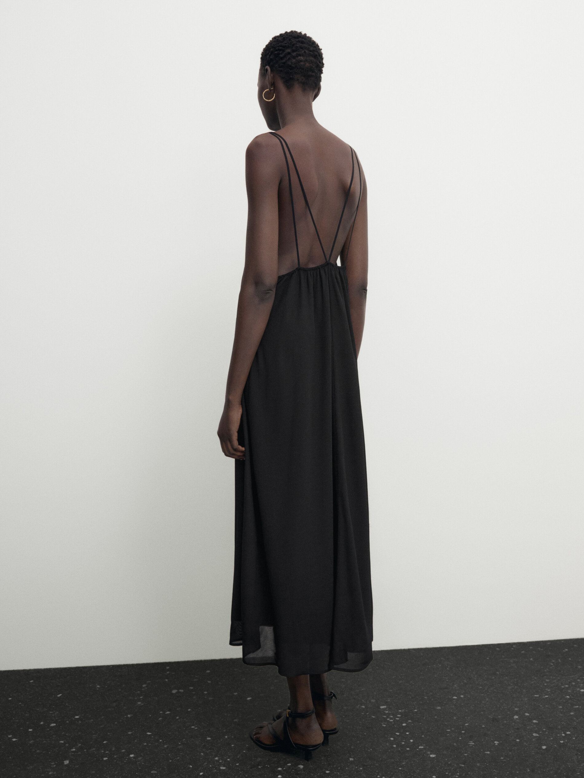 Flowing dress with double straps and open back