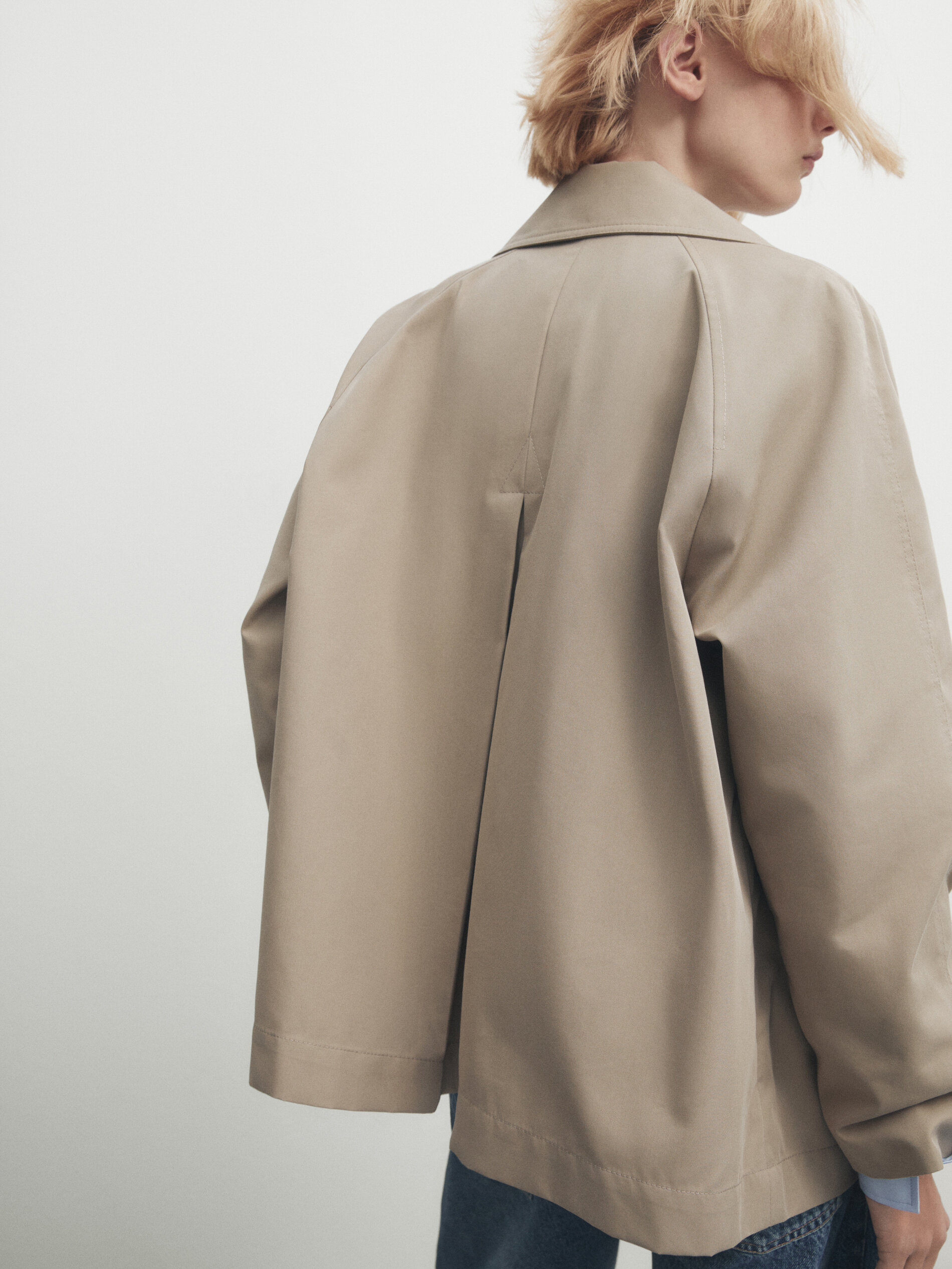 Short trench coat with back pleat · Beige · Coats And Jackets