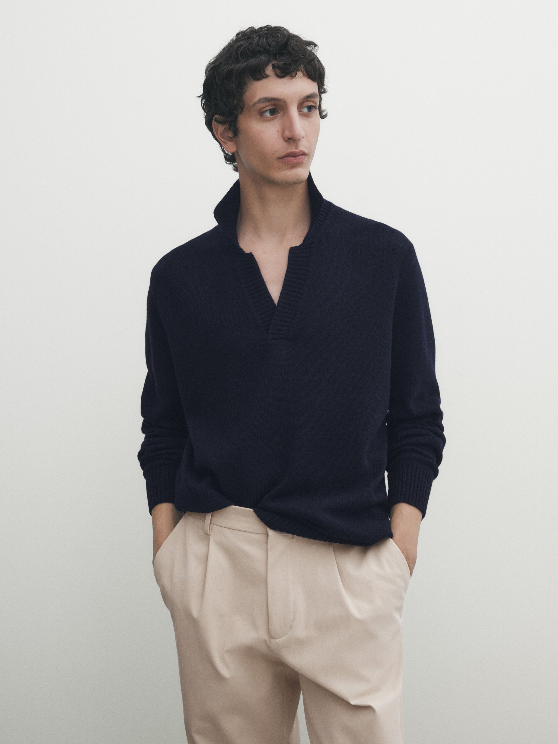 Knit sweater with a polo collar and ribbed trims