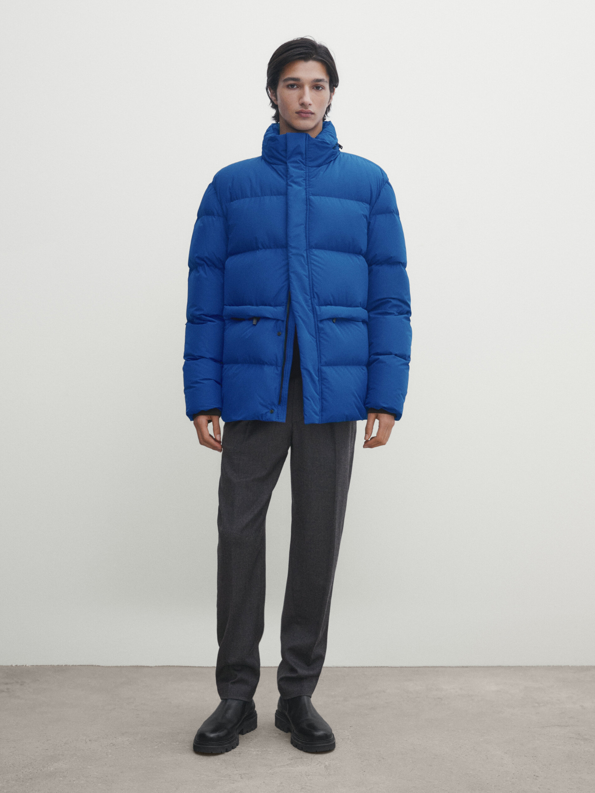 Jacket with down and feather padding and hidden hood
