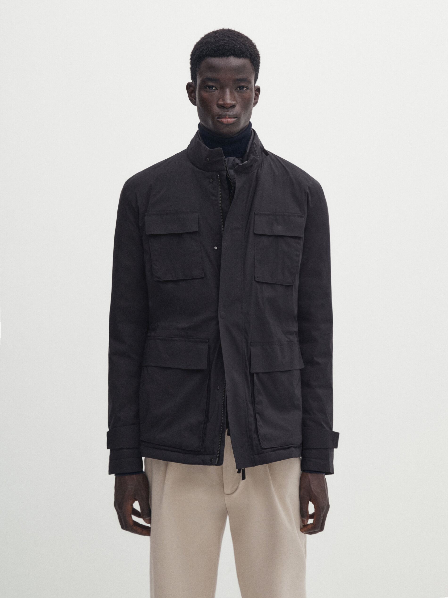 Jacket with pockets and down and feathers filling