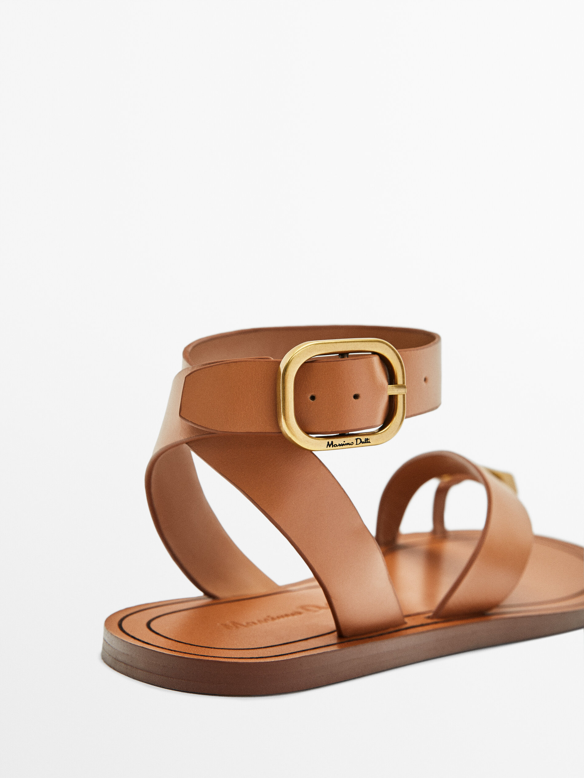 Leather flat slider sandals with metallic piece
