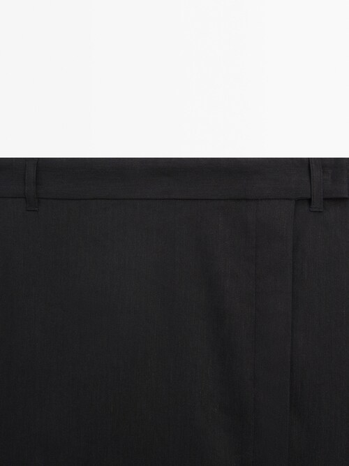 Falda negra stretch con textura de hilo. Largo 48cm, Talla S/M