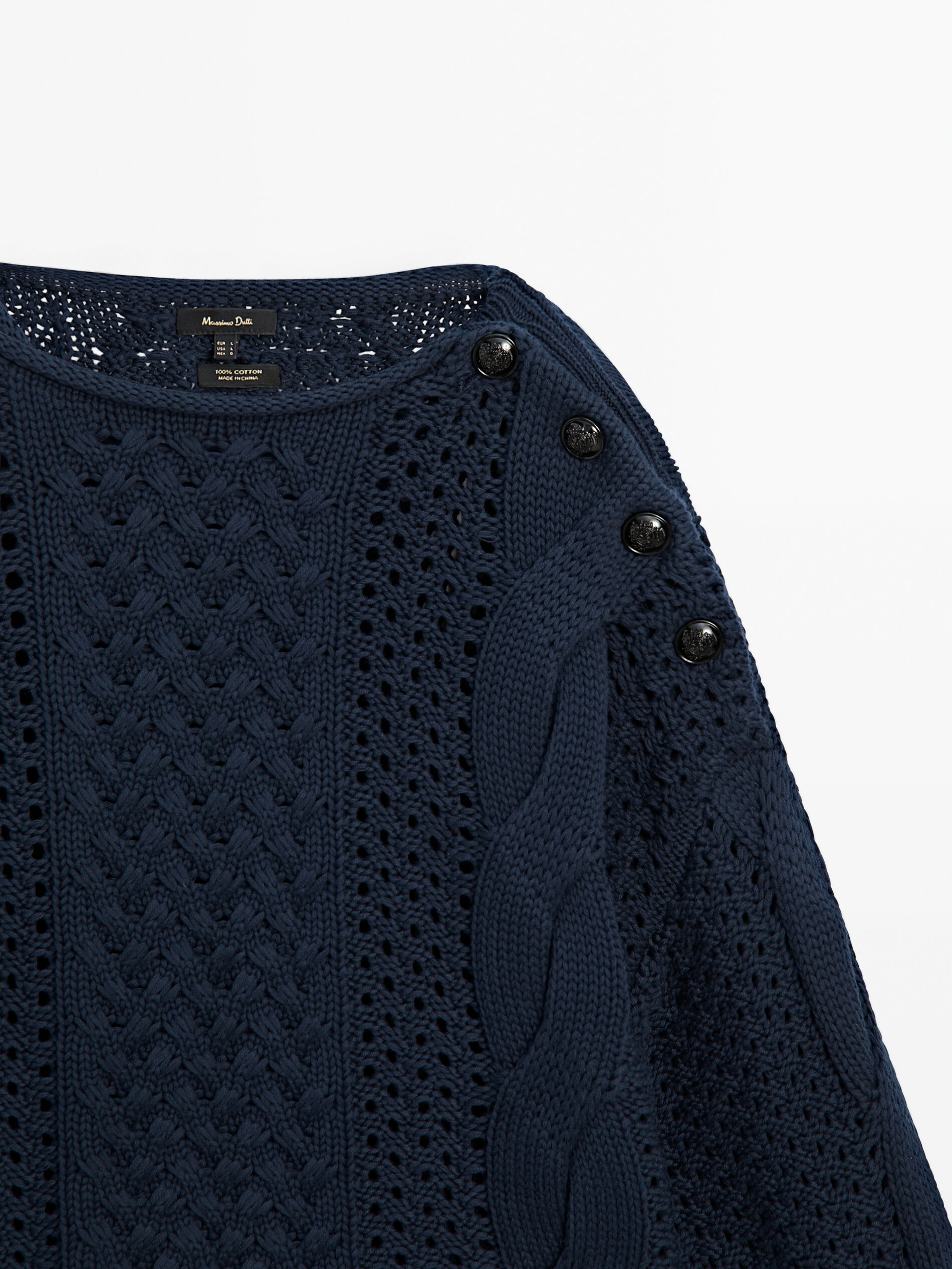 Open knit sweater with button detail