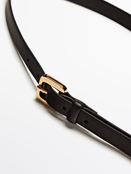 Thin leather belt with round buckle