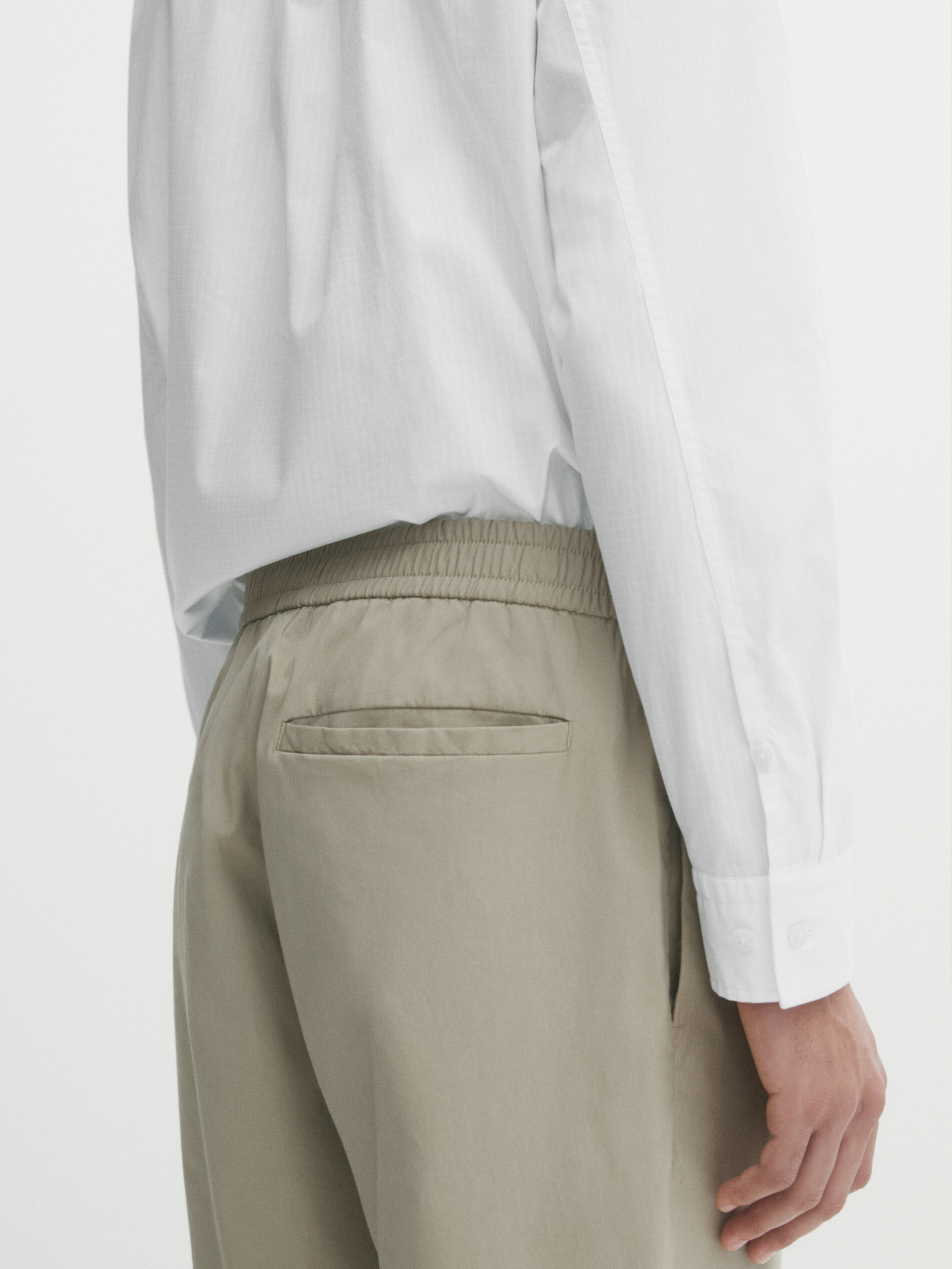 Dôen Valentin Pleated Cotton-Poplin Wide-Leg Pants | Wardrobe Icons