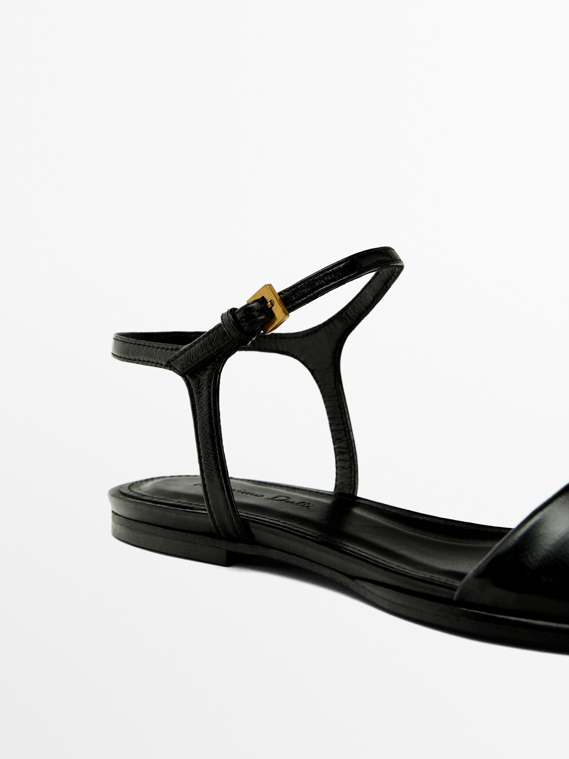 Flat creased patent finish sandals