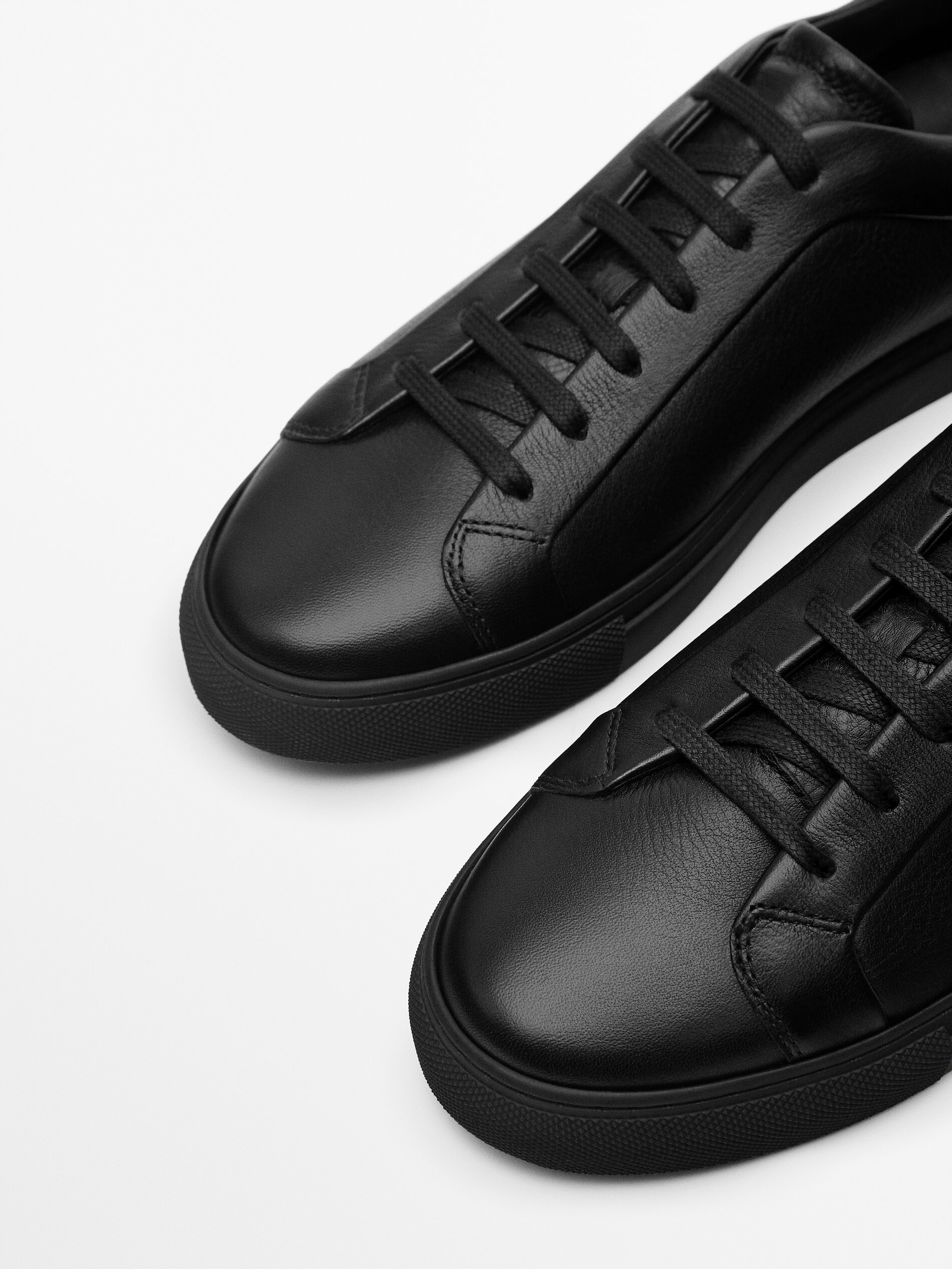 Black leather trainers
