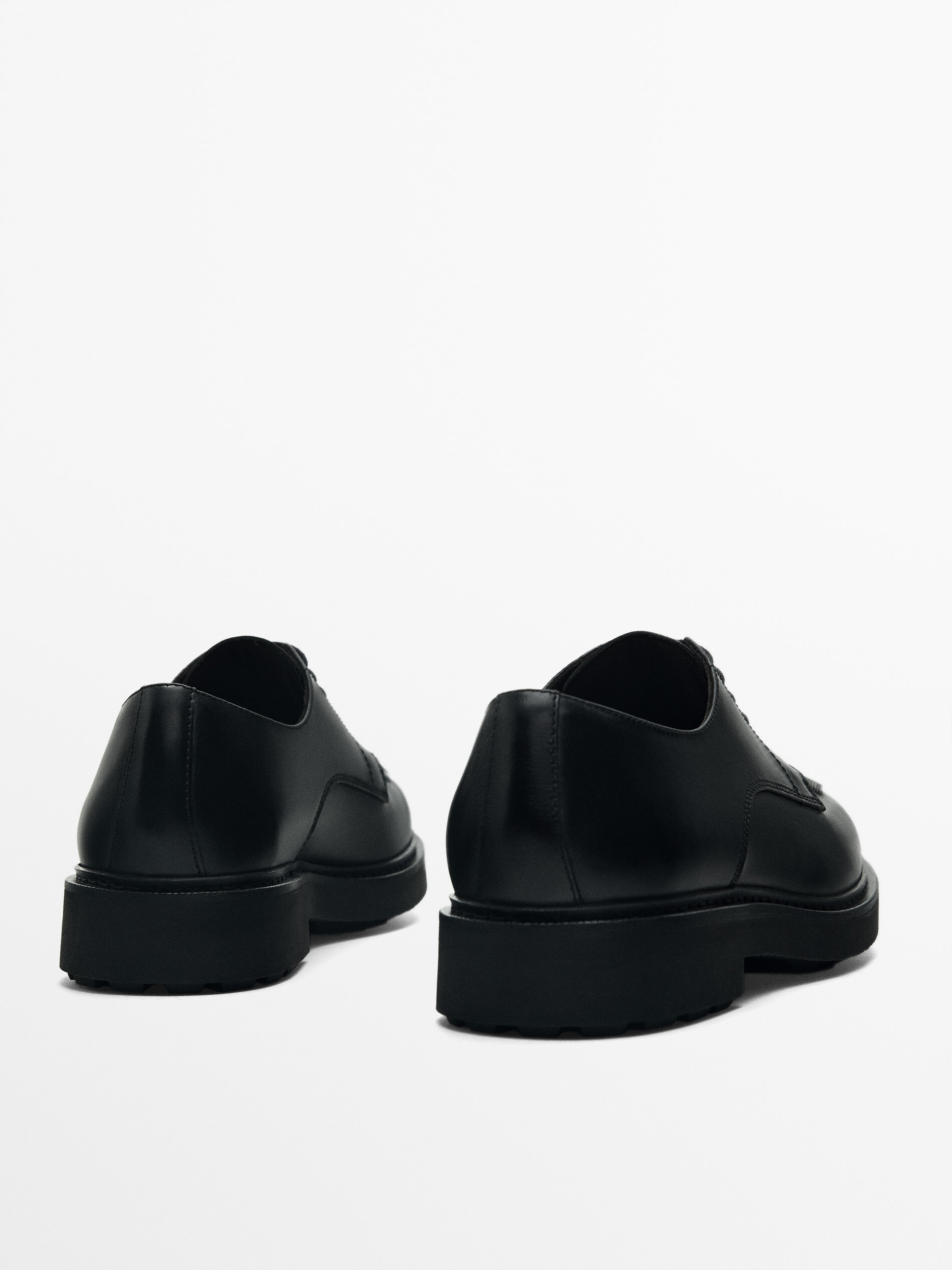 Black moc toe shoes