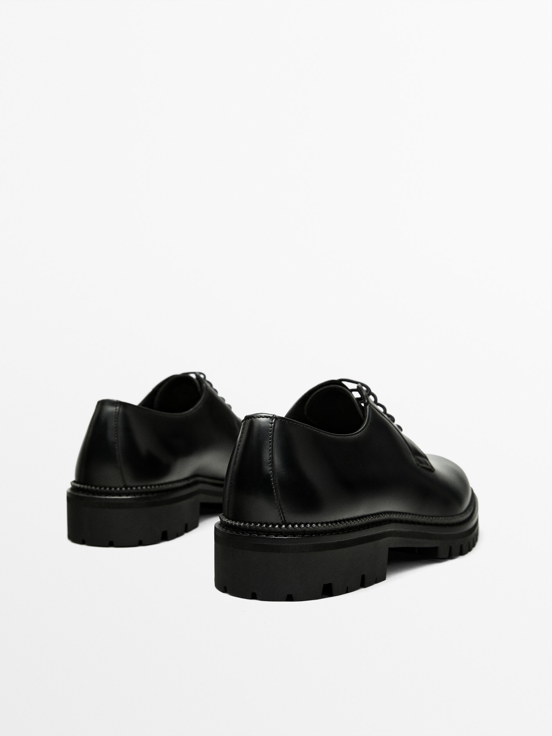 Black leather shop soled shoes