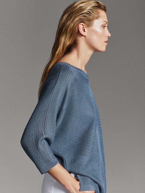 Textured weave cape-style sweater. 