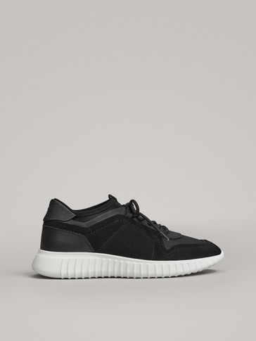 black sock style trainers