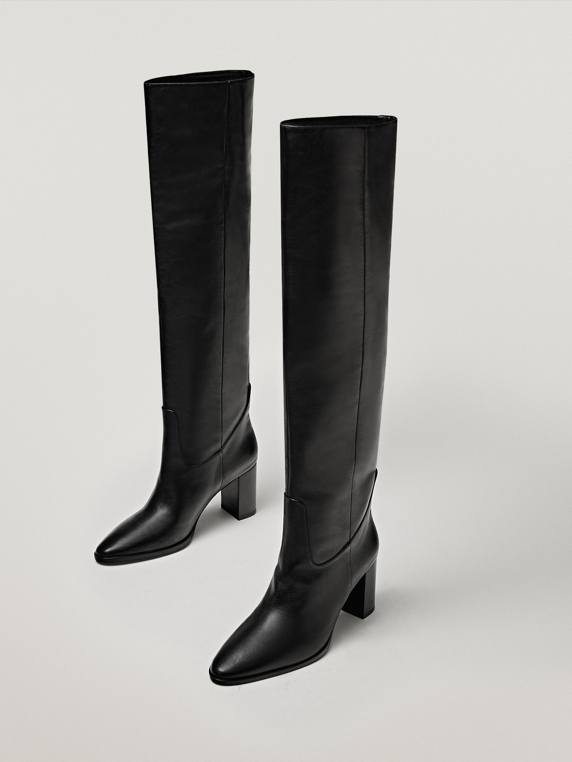 heeled black leather booties