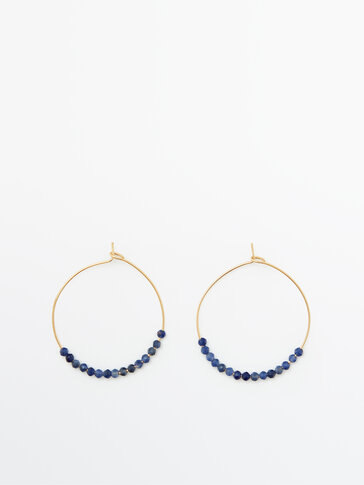 Gold-plated hoop earrings with blue stones