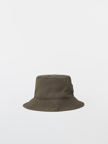 Bucket hat with leather strap