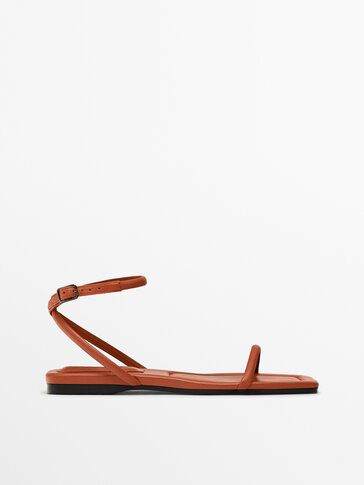 FLAT ORANGE LEATHER SANDALS WITH CROSSOVER STRAPS