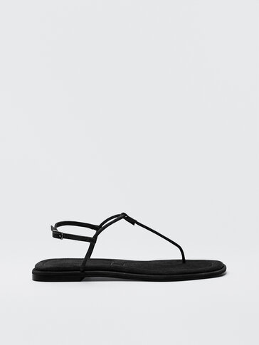 Flat black strappy sandals