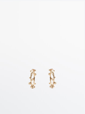 Gold-plated earrings with an uneven texture