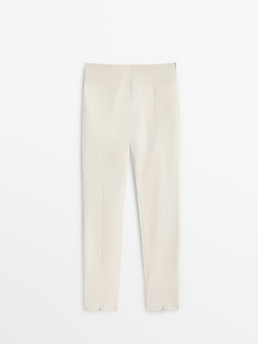 Skinny trousers with zipped hems