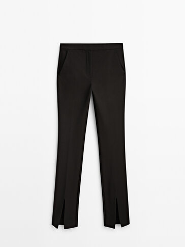 Black slim fit trousers with split hems