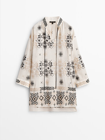 Oversize blouse with embroidered details