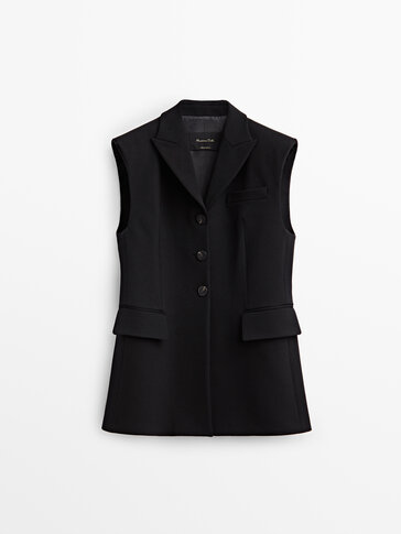 Long black buttoned waistcoat