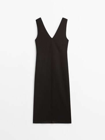 Black V-neck dress with shoulder pads