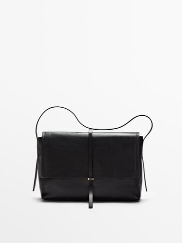 Black leather bag with flap
