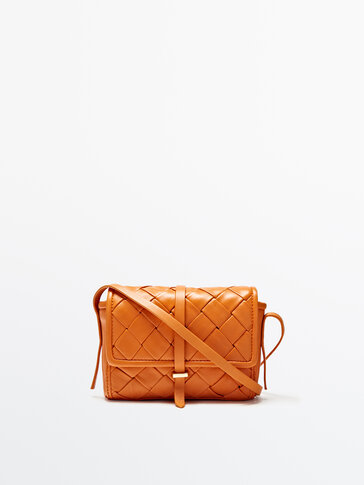 Braided leather crossbody bag with flap