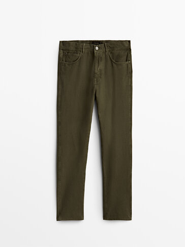 Siaurėjančios džinsų modelio kelnės iš medvilnės ir lino