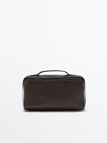 Leather toiletry bag with central zip