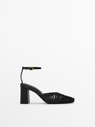 Leather heeled sandals with braided vamp