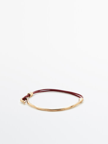 Leather cord bracelet with metal piece