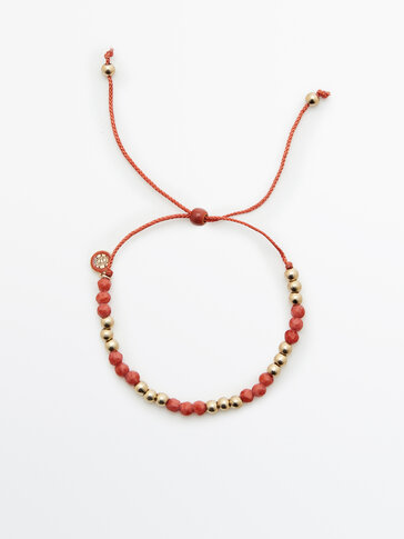 Bracelet cordon rouge et perles