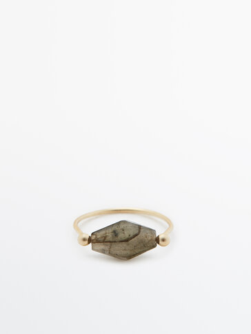 Ring with diamond-shaped stone
