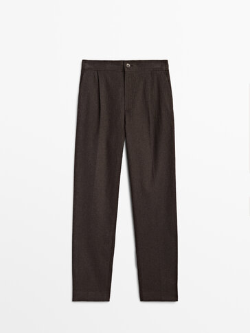 Pantaloni con pince spigati in cotone