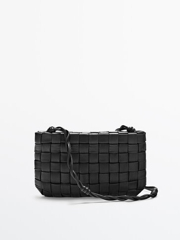 Woven leather clutch-style handbag
