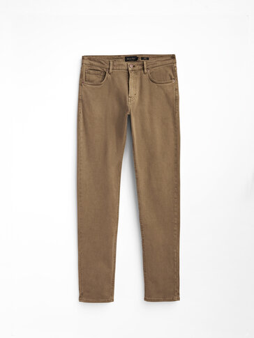 Keprové džínsové nohavice úzkeho strihu s roztrhaným efektom