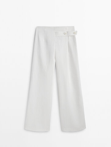 Pantalon large en lin enduit lanière boutonnée